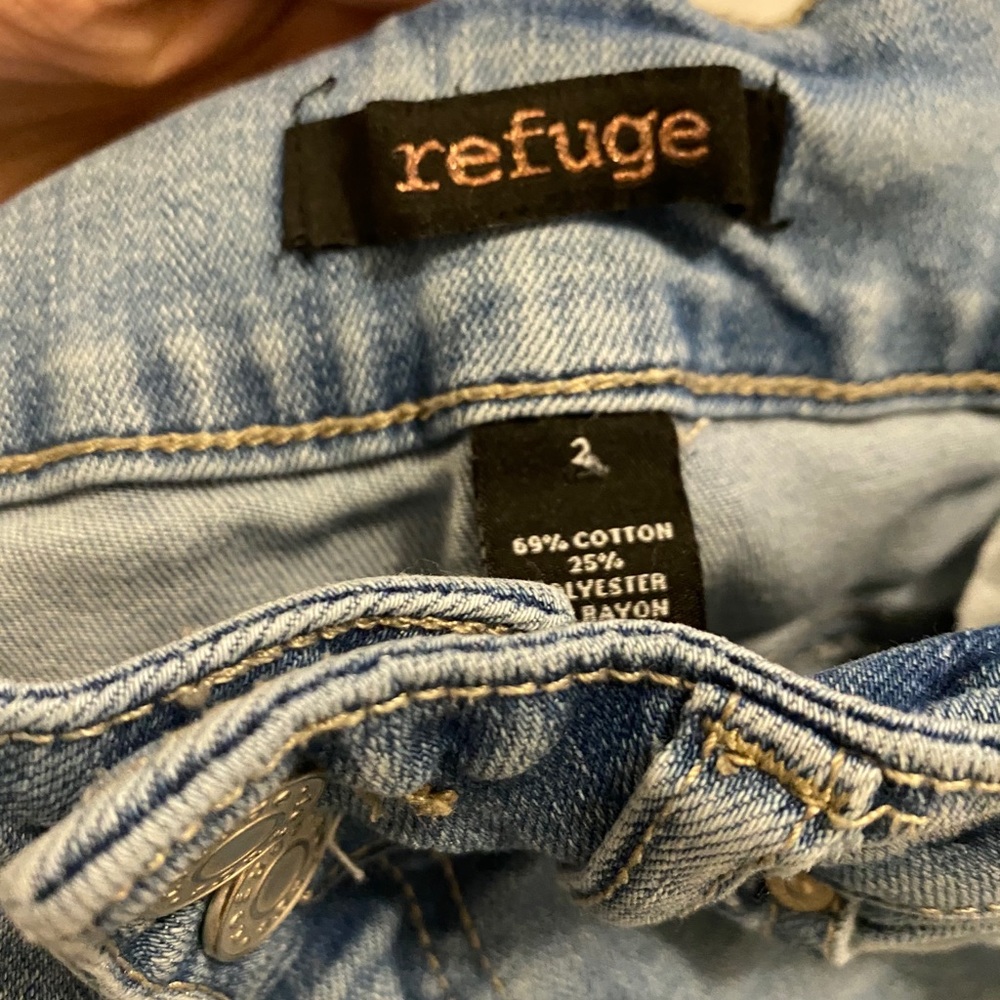 Blue distressed shinny jeans